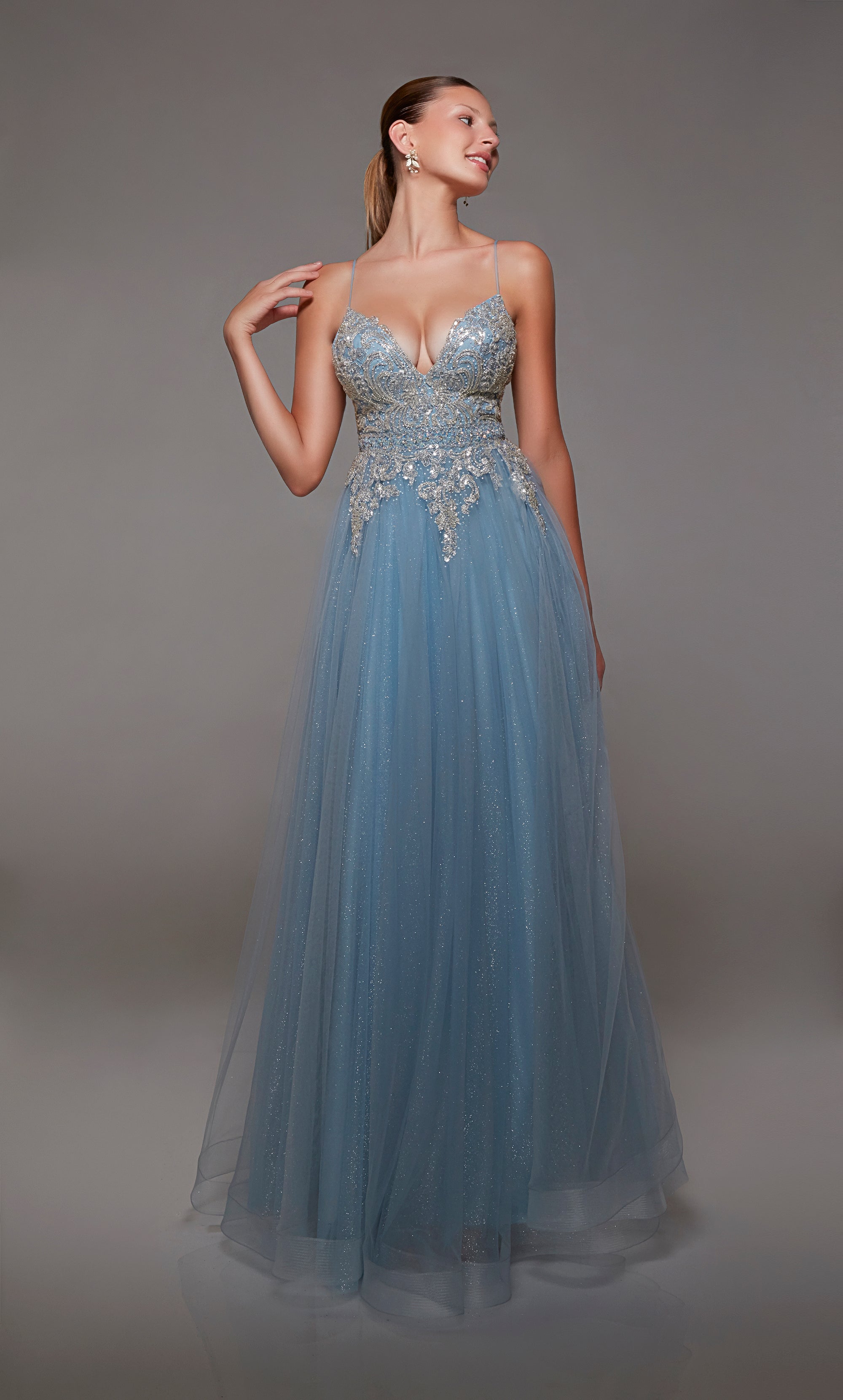 French blue glitter tulle formal dress: Plunging neckline, beaded lace bodice, zip-up back, and spaghetti straps for an elegant and enchanting look.