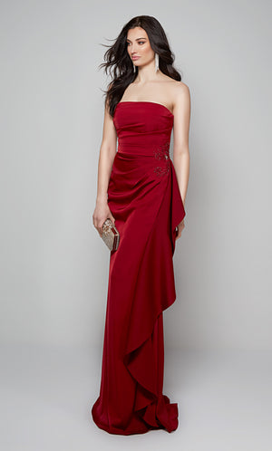 Long red ruffle dress with lace applique at the hip.