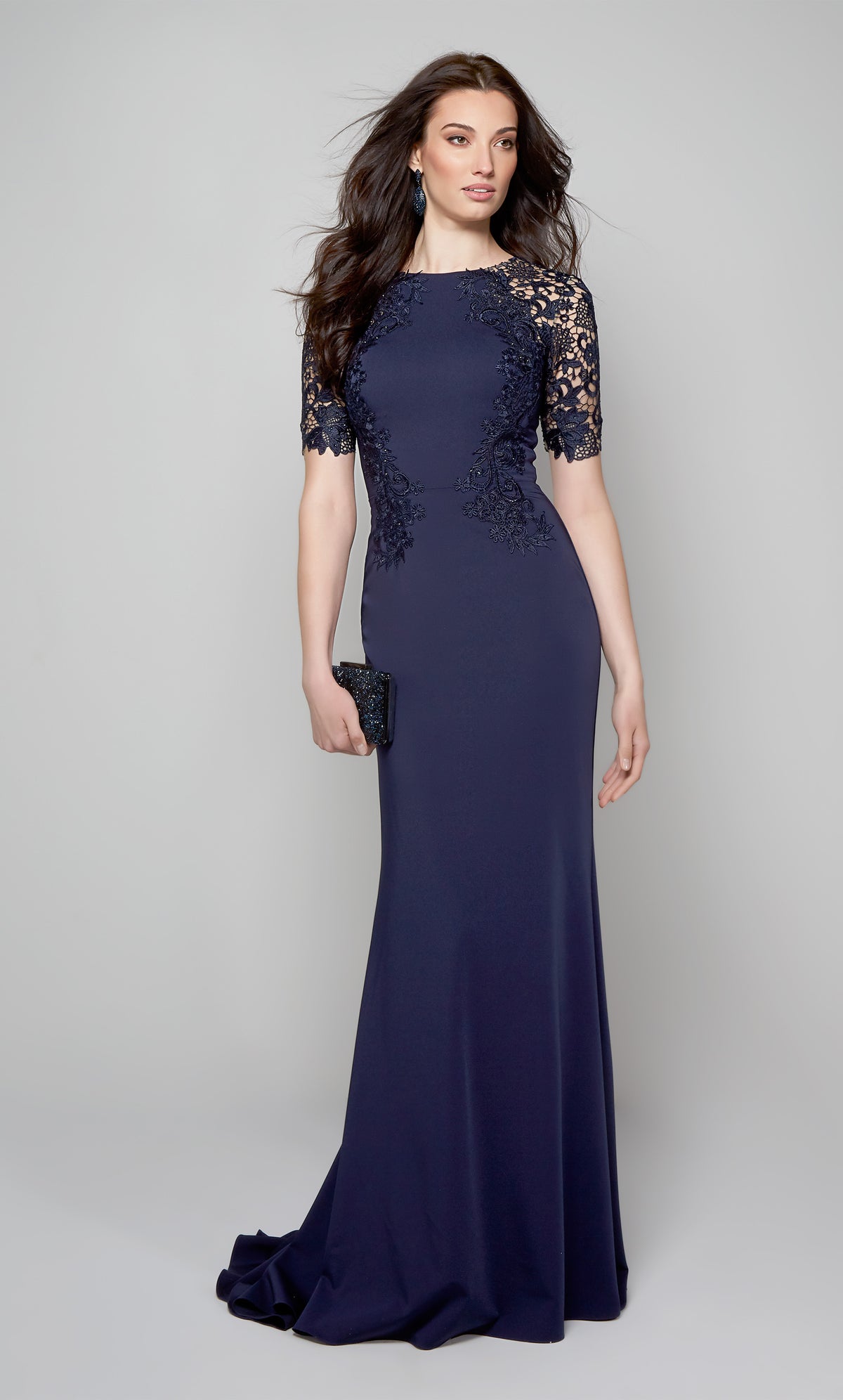 Midnight blue evening gown with short sleeves and lace detail.