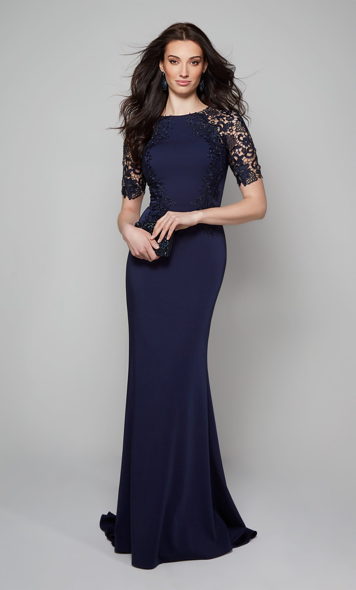Elegant formal dress with a fit and flare silhouette, short sleeves, and lace detail.