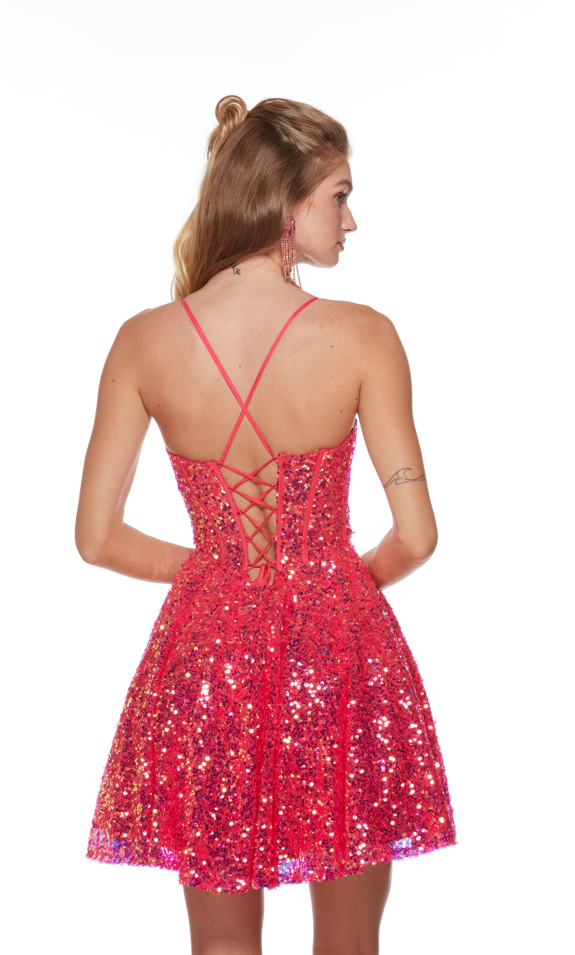 A short, hot pink sequined corset dress with a  V neckline, A-line silhouette, and lace up back for the perfect fit.