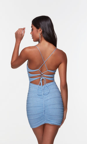 Short blue bodycon homecoming dress with a strappy back and ruching detail. 