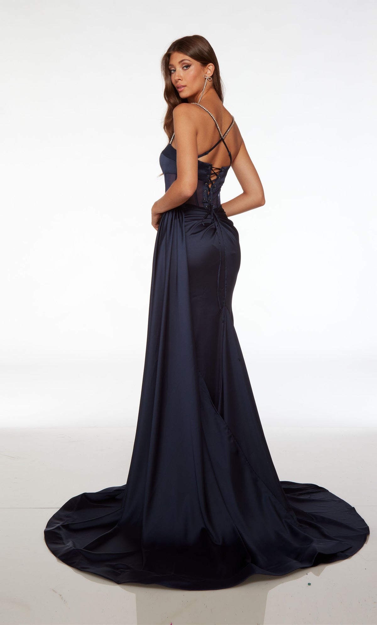Midnight blue satin gown: Plunging sheer corset top, high slit, ruching detail, train, and detachable side train for added drama and flair to the elegant look.