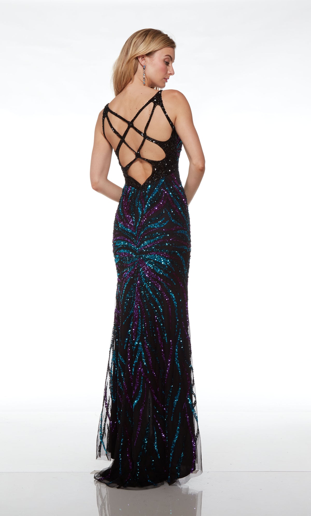 Unique black-teal hand-beaded designer dress with an V neckline, high slit, striking open back, and an slight train for an captivating look.