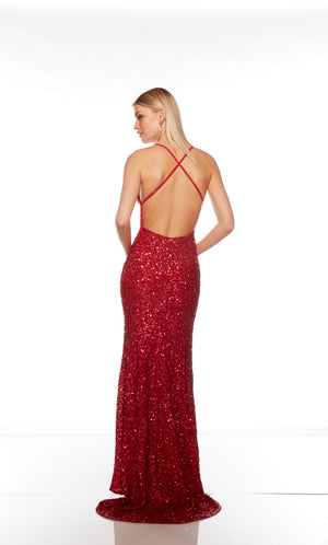 Red sequin gown with an V neckline, slit, and crisscross adjustable strap back, and an slight train for an elegant and alluring look.