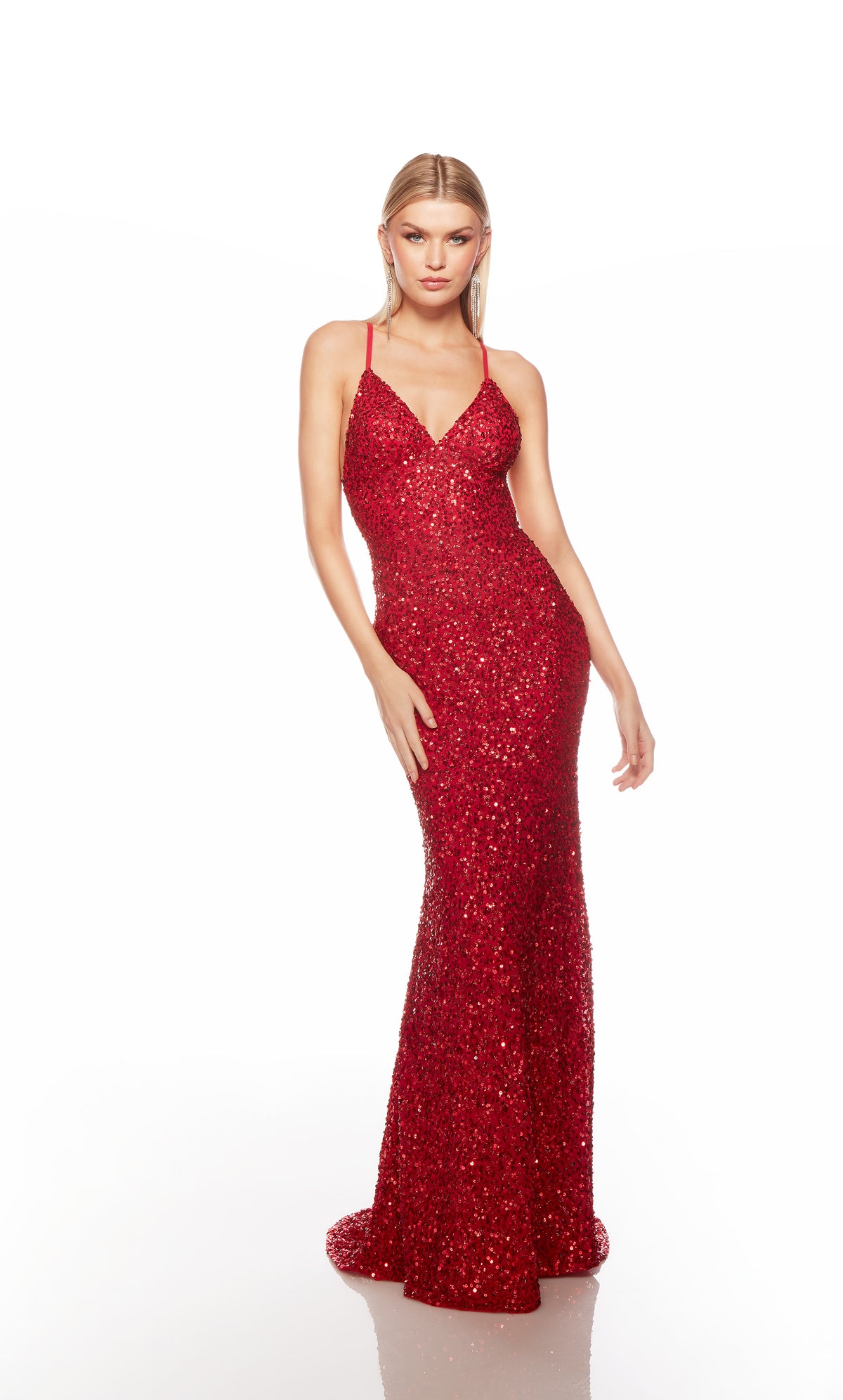 Red sequin gown with an V neckline, slit, and crisscross adjustable strap back, and an slight train for an elegant and alluring look.