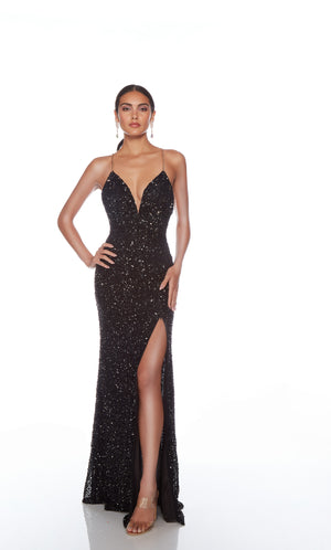Sophisticated black sequin gown: Plunging neckline, slit, gold chain straps for an edgy and elegant vibe.