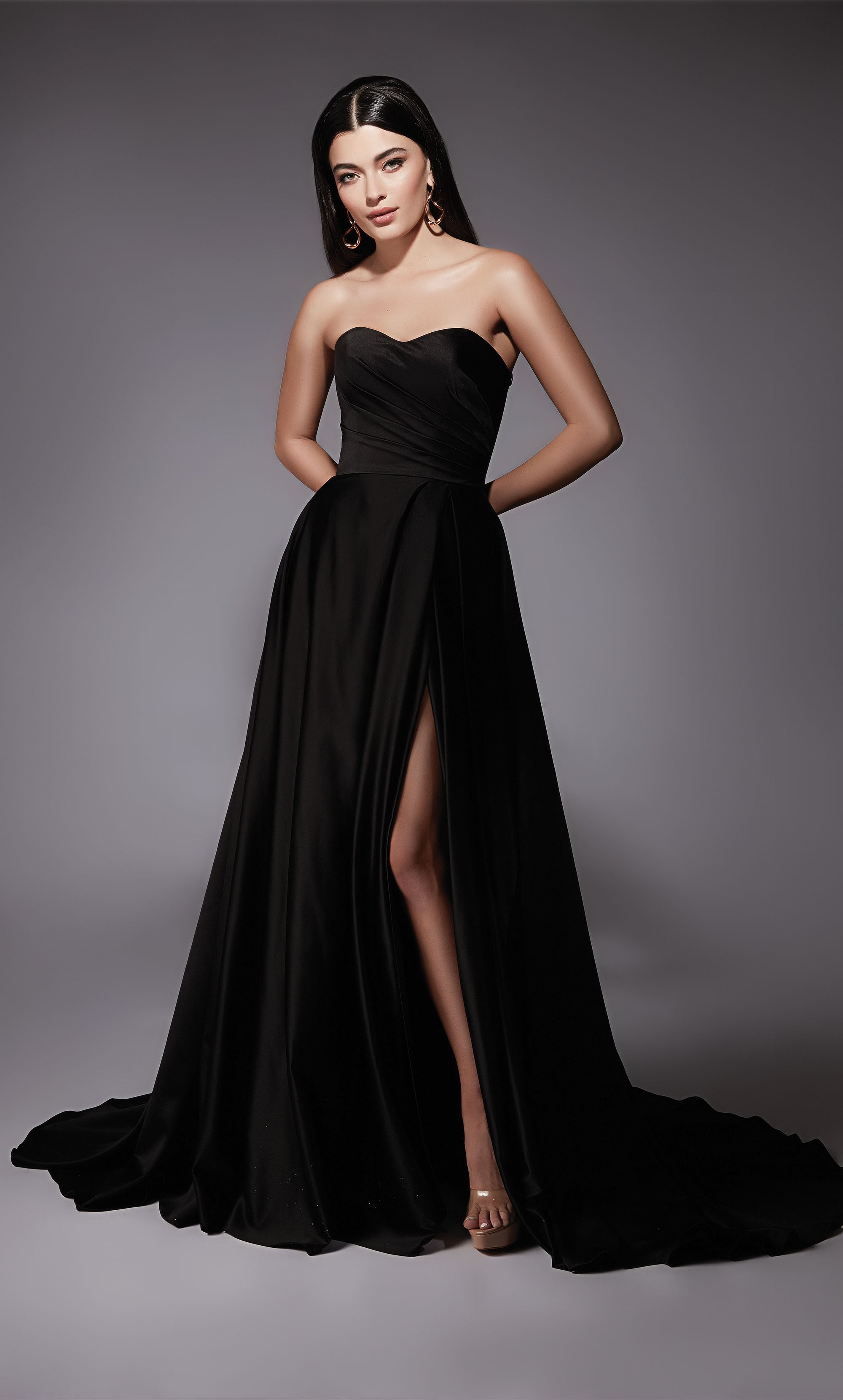 A-line satin bridal gown featuring a strapless, semi-sweetheart neckline, a pleated bodice, and high side slit in the color Black.