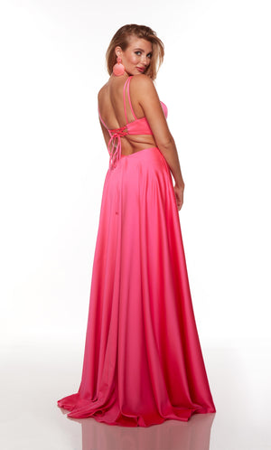 Flowy formal dress with a lace-up back and train in hot pink.