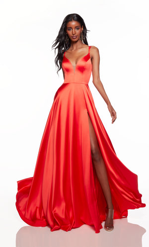 Flowy formal dress with a lace-up back and train in orange.