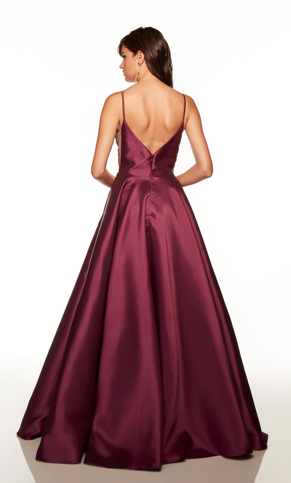 Sweetheart ballgown with a V shaped back and pockets in the color black plum.