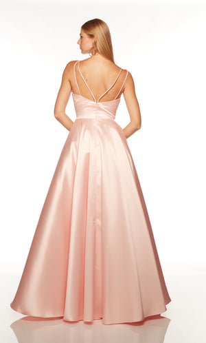 Pink ballgown with pockets and a strappy back.