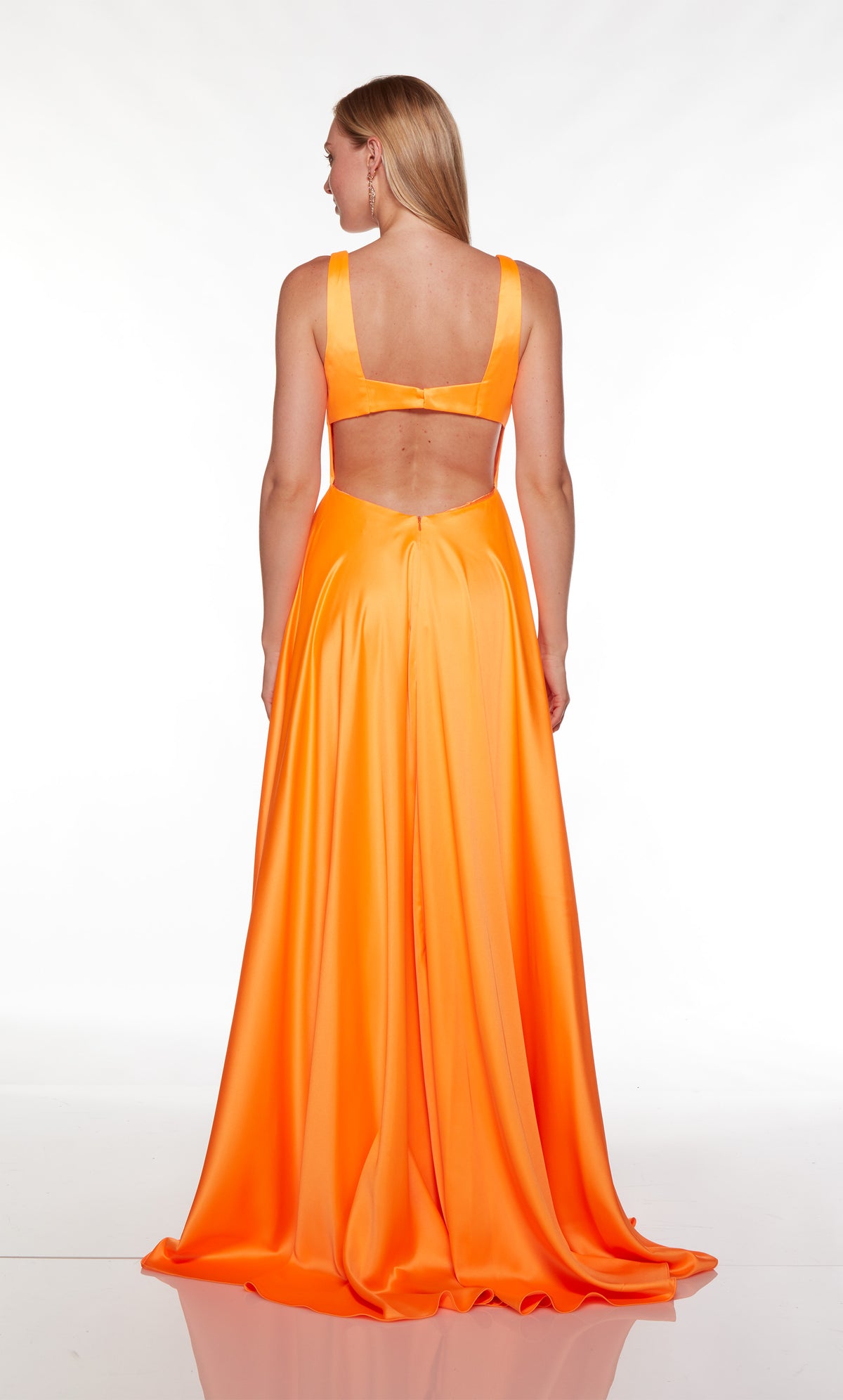 Orange prom dress with a cutout back and train.