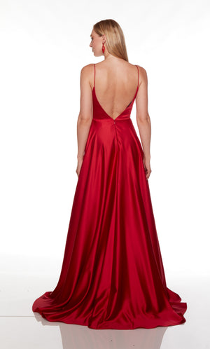 Red prom dress with a V shaped open back and train.