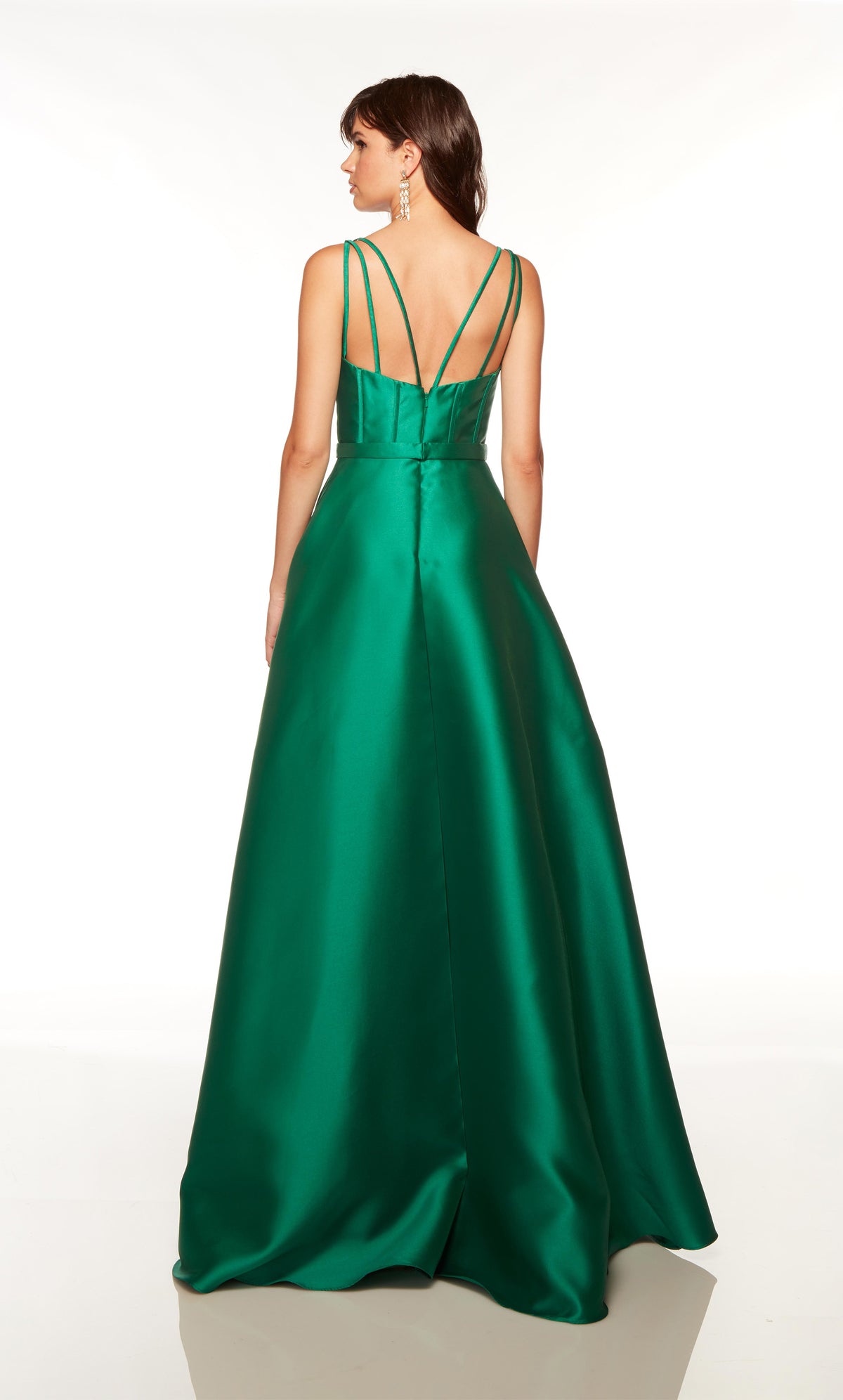 Green evening dress with a strappy back and slight train.
