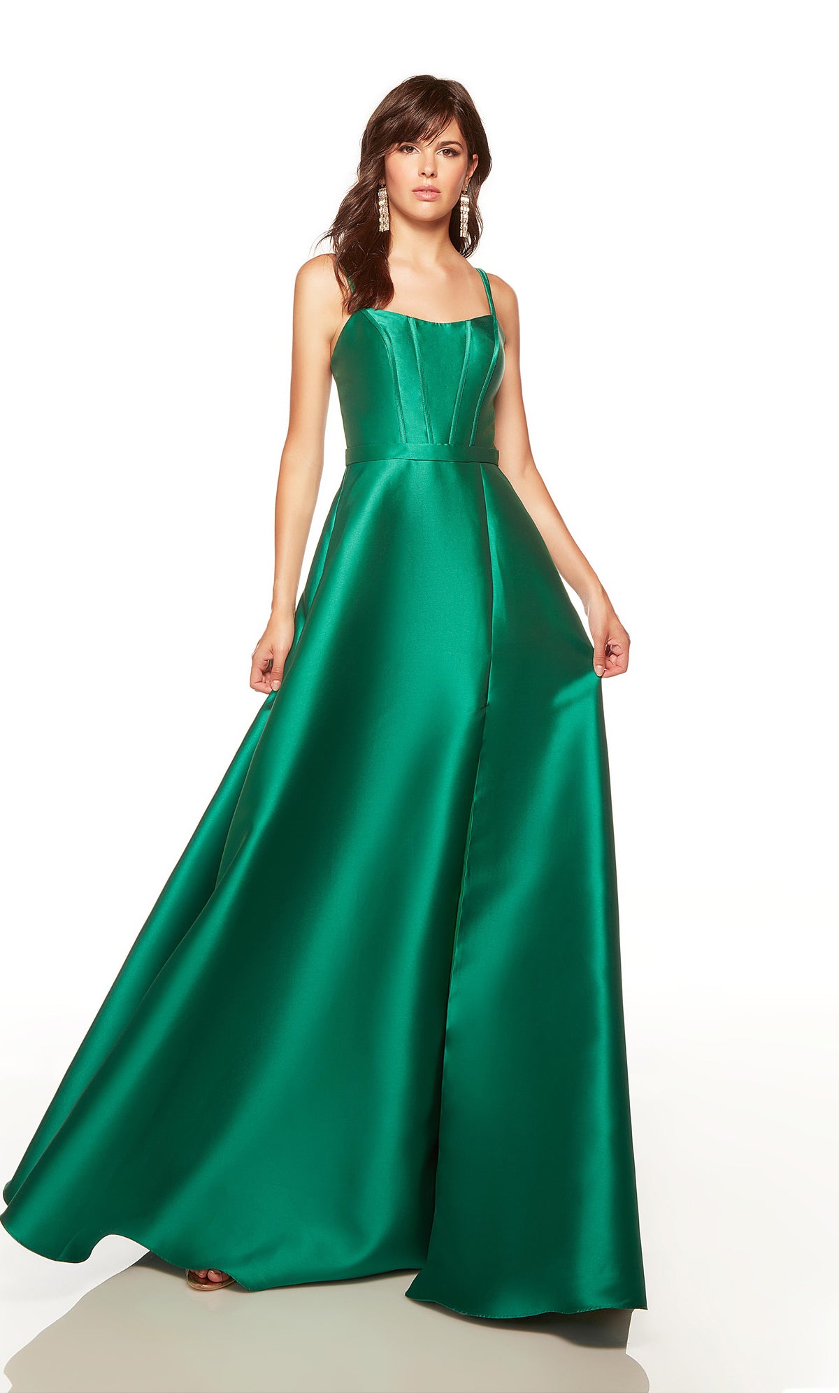 Long formal dress with a scooped neck, corset bodice, belt, and side slit in emerald green.