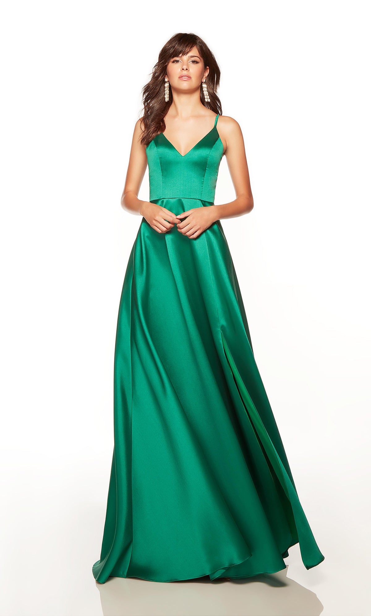 Plus size prom dress with a V neckline and side slit in pine green.