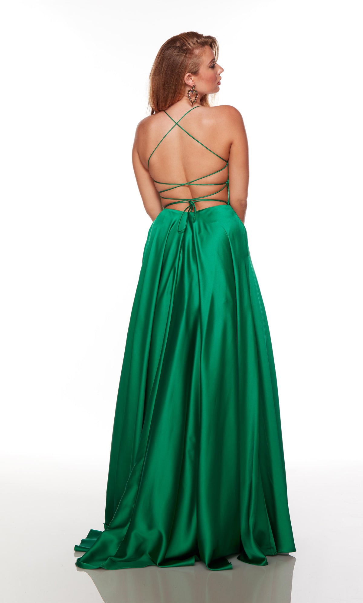 Green plus size dress with a strappy, lace-up back and train.
