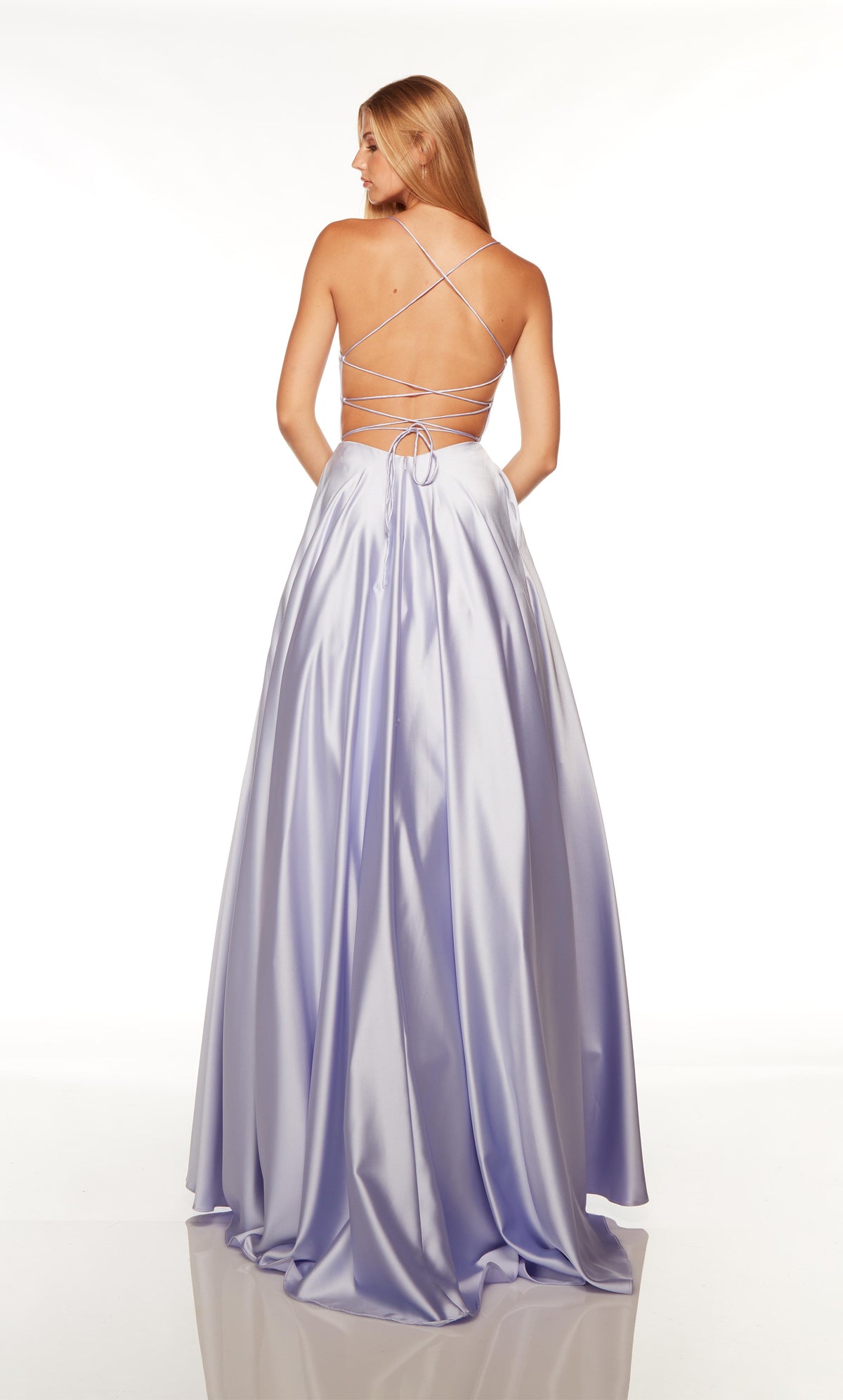 Lilac purple formal dress with a strappy, lace-up back and train.