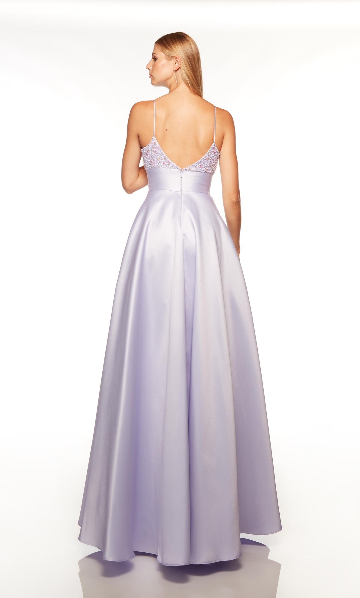 Lilac dress with a V shaped back and pockets.