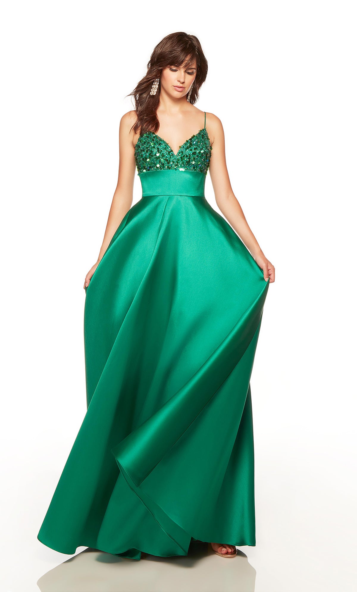 Green gown with a sweetheart neckline, beaded bodice, and pockets.