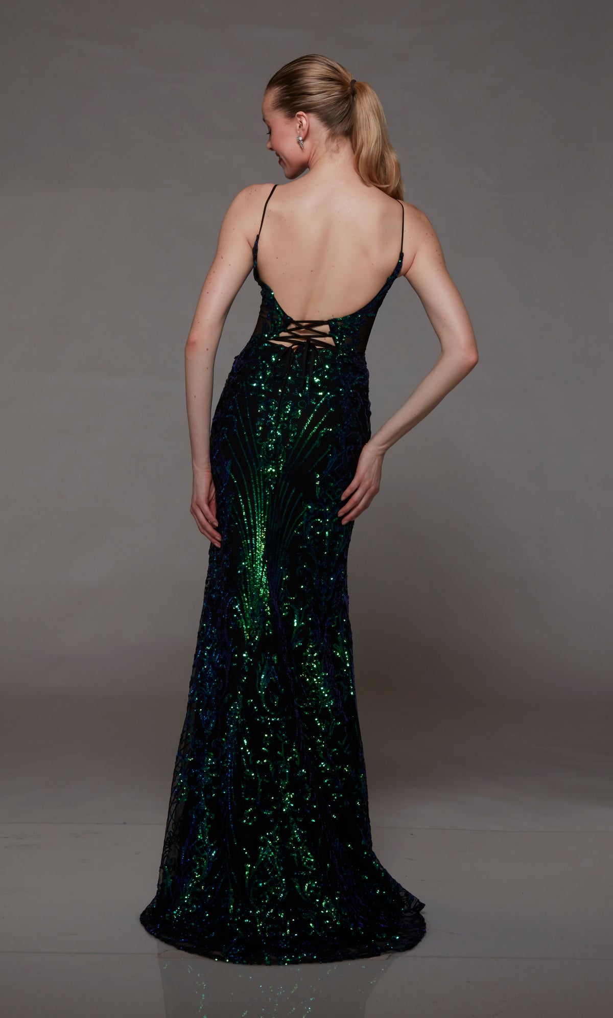 Dark green sequin formal gown: plunging neckline, front slit, lace-up back, slight train. A stunning choice for an elegant and glamorous occasion.