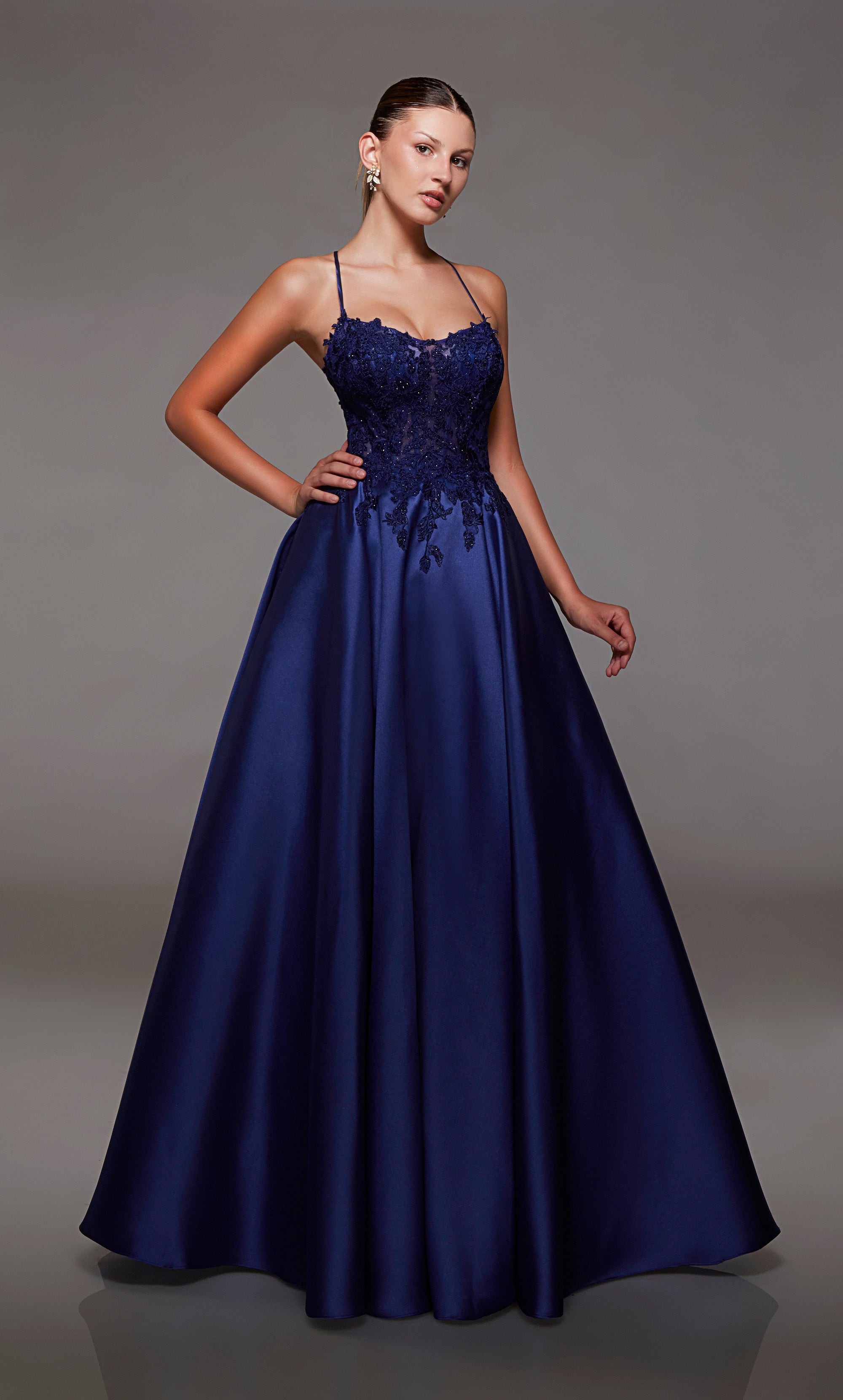 Navy mikado ball gown with lace corset, strappy back, and slight train for an stylish and vibrant look.