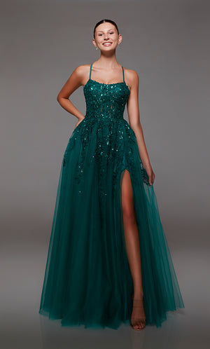 Green prom dress: sheer corset bodice, full tulle skirt with front slit, lace-up back, and intricate floral lace appliques for an enchanting look.