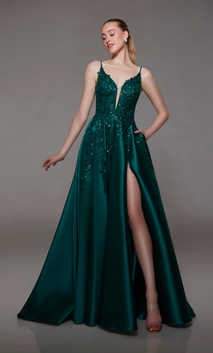Plunging pine green A-line designer gown featuring an front slit, convenient pockets, sequined floral lace appliques, an stylish V-shaped back, and an subtle train for an chic and modern elegance.