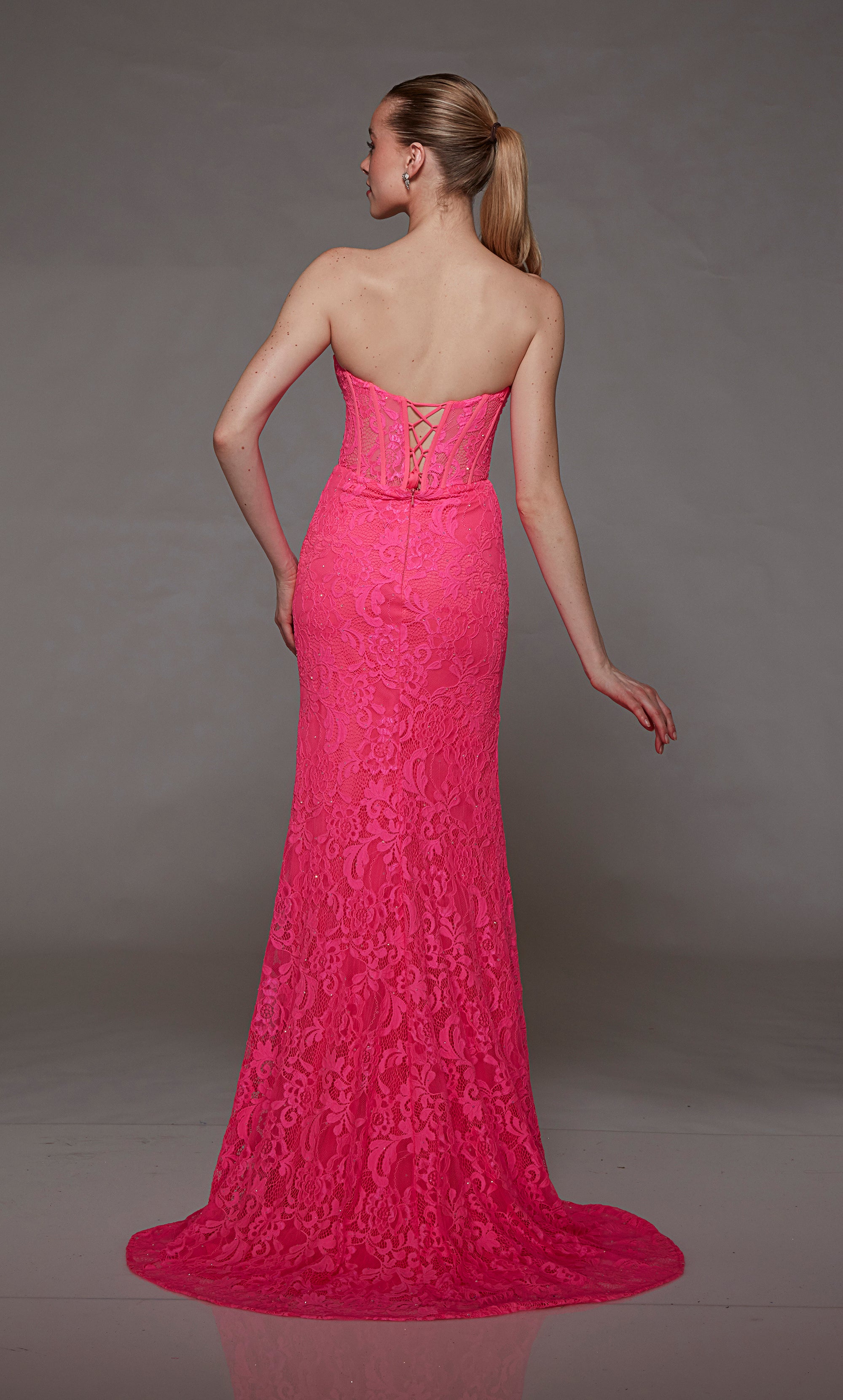 Hot pink lace strapless corset dress: High slit, lace-up back, and an graceful train for an bold and stylish statement.