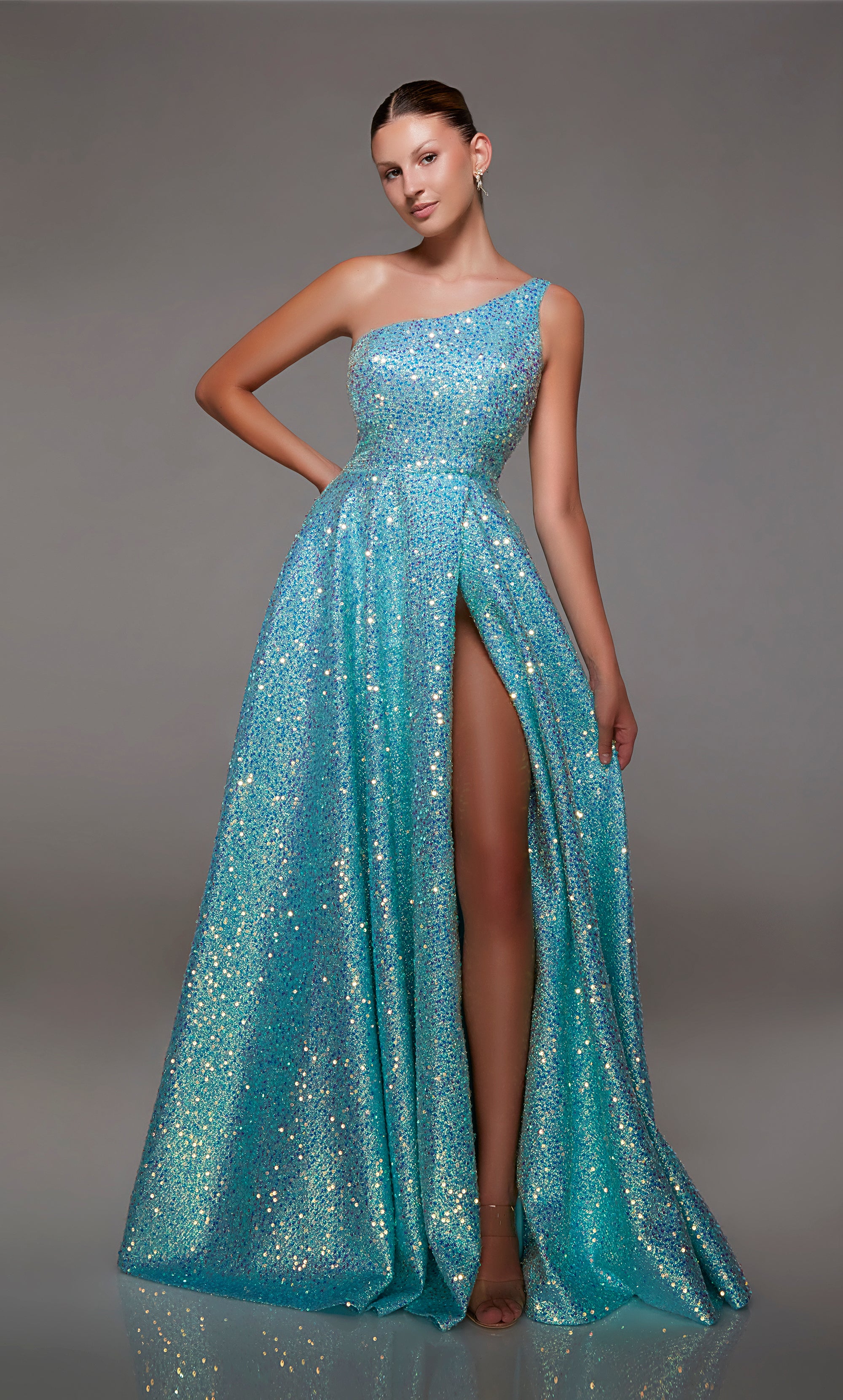 Elegant light blue one-shoulder gown: High slit, zip-up back, and an slight train in sparkly iridescent sequin fabrication for an glamorous and sophisticated look.