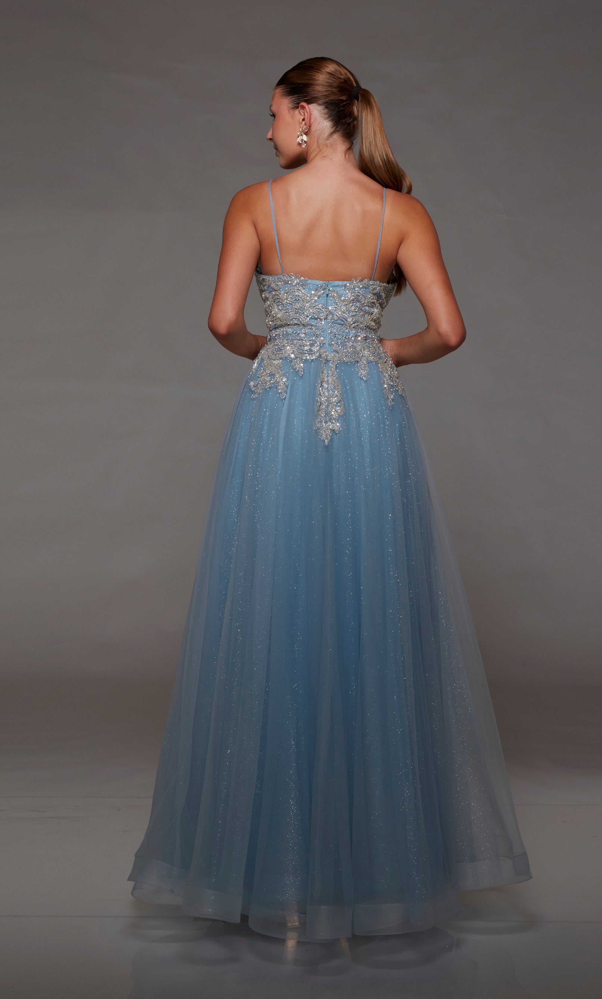 French blue glitter tulle formal dress: Plunging neckline, beaded lace bodice, zip-up back, and spaghetti straps for an elegant and enchanting look.