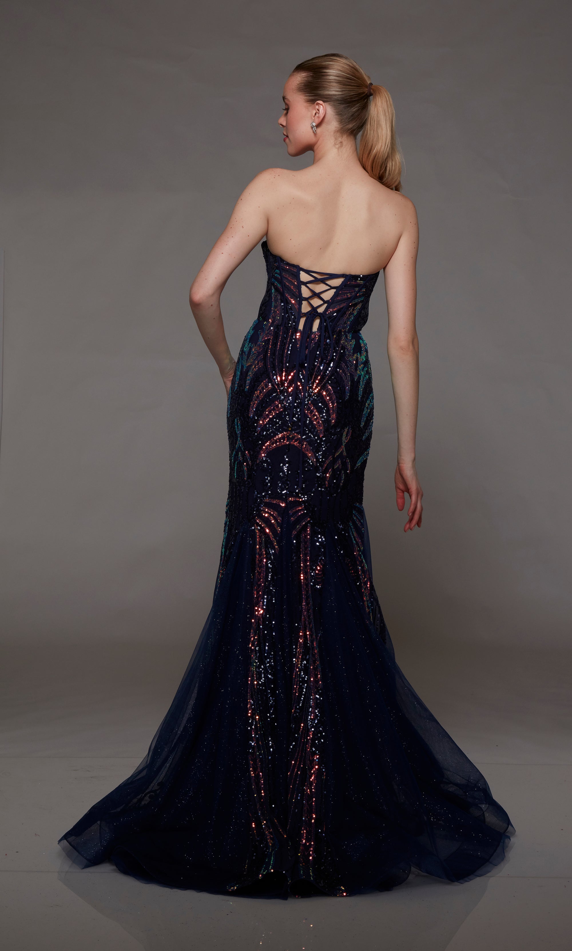 Navy blue mermaid dress: Strapless neckline, keyhole cutout, playful iridescent sequin detail. Back features an lace-up closure for the perfect fit.