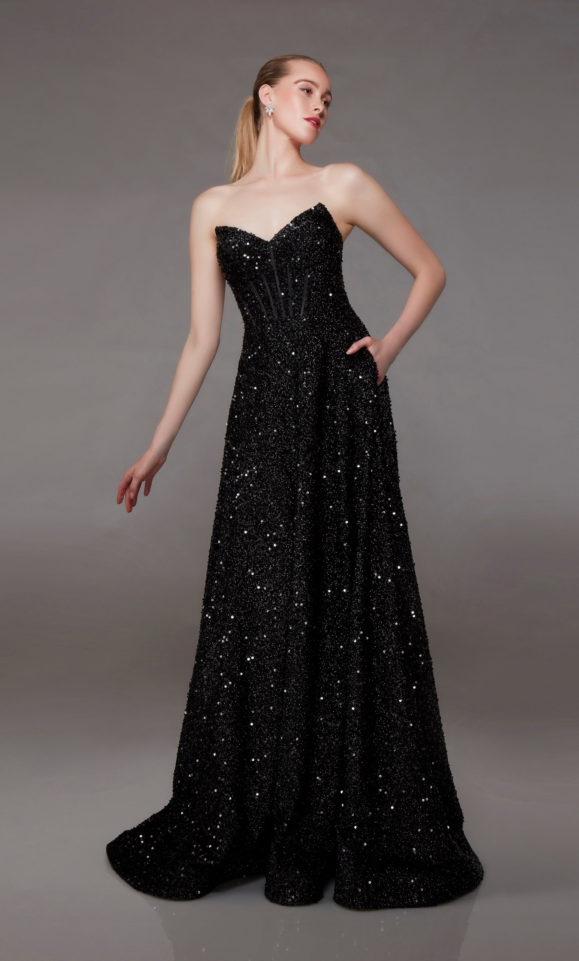 Elegant black prom dress: Strapless corset top, A-line skirt, lace-up back, elegant train, and practical pockets for an stylish and functional look.