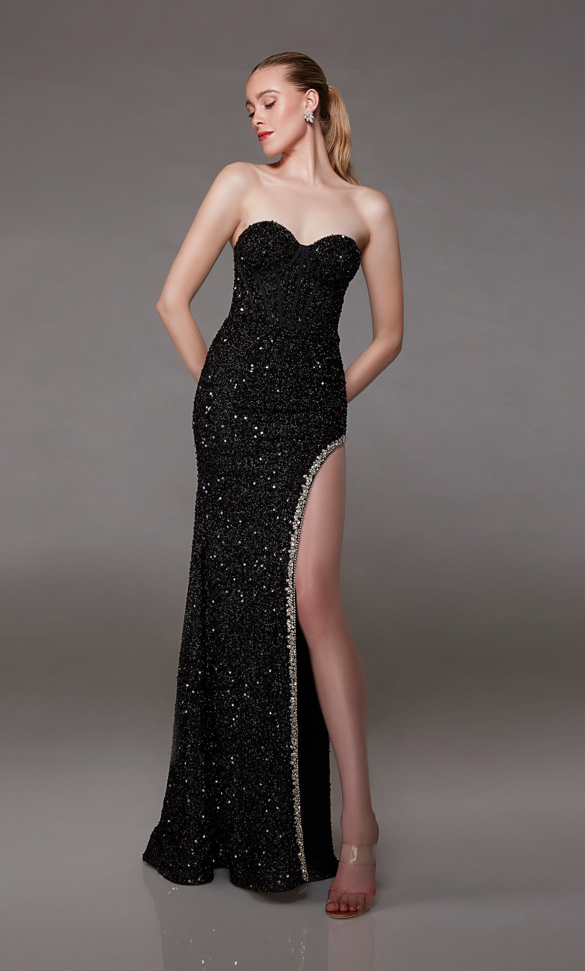Sparkly black prom dress: Sweetheart neckline, stunning silver rhinestone-trimmed side slit, and an train for an modern twist on an classic style.
