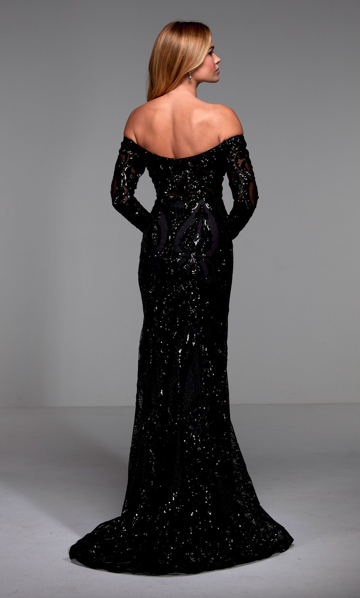 Sexy black, off the shoulder evening gown with long sleeves, sequin embellishment, and a train.