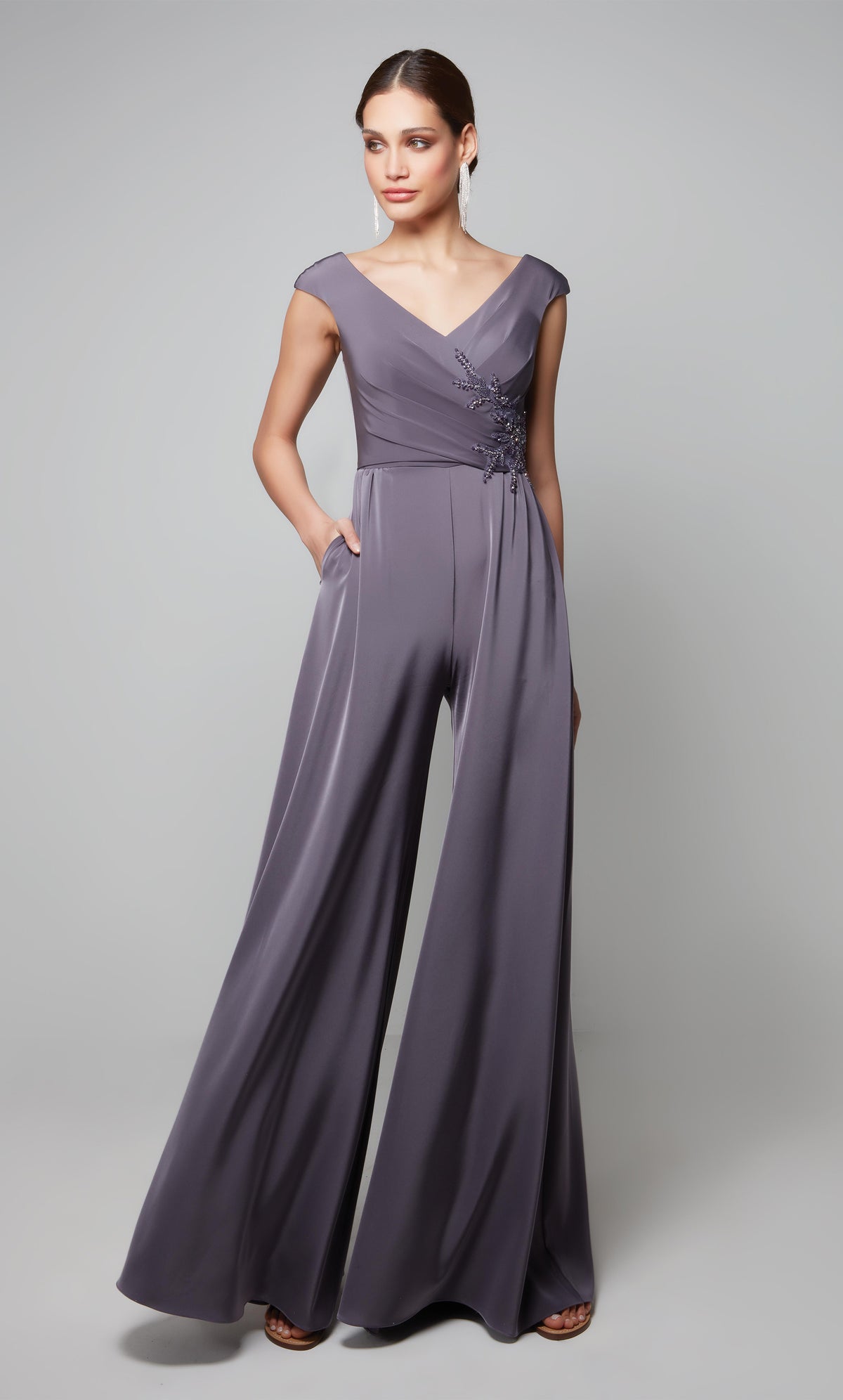 Graphite mother of the bride jumpsuit with lace applique at the waist.