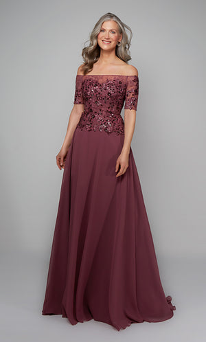 Chiffon gown with an off the shoulder neckline and floral appliques in purple.