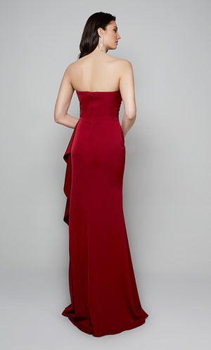 Long strapless fit and flare gown with a side ruffle and zip up back in red.