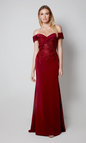 Elegant mother of the groom dress with an off the shoulder neckline and fit and flare silhouette in burgundy.