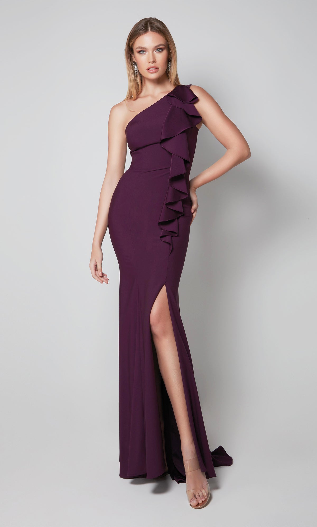 Long one shoulder ruffle dress with a side slit in purple.