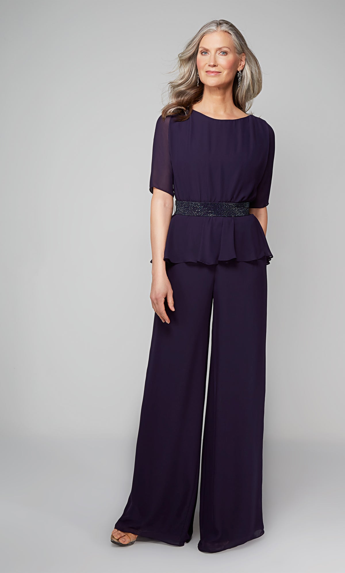 Peplum jumpsuit with short sleeves and a faux beaded belt at the waist in dark blue. Color-SWATCH_27576__PATRIOT-BLUE