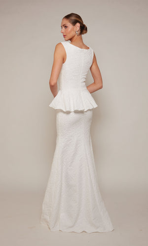 Diamond White peplum gown with an closed zipper back and train.