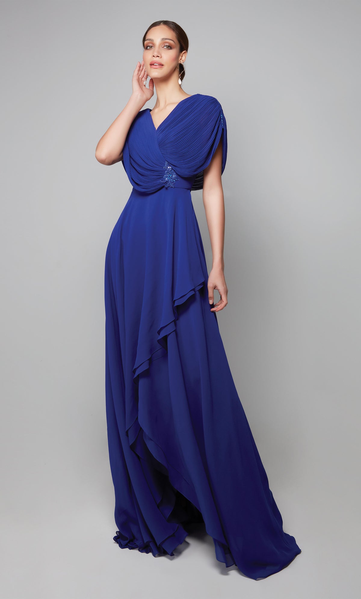 Flowy chiffon gown with a draped top, tiered skirt, and decorative lace applique at the natural waist in cobalt blue. Color-SWATCH_27592__COBALT