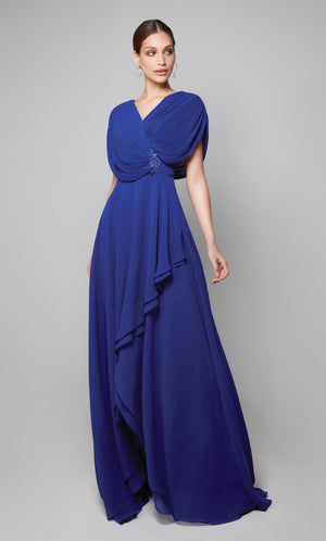 Flowy chiffon gown with a draped top, tiered skirt, and decorative lace applique at the natural waist in cobalt blue.