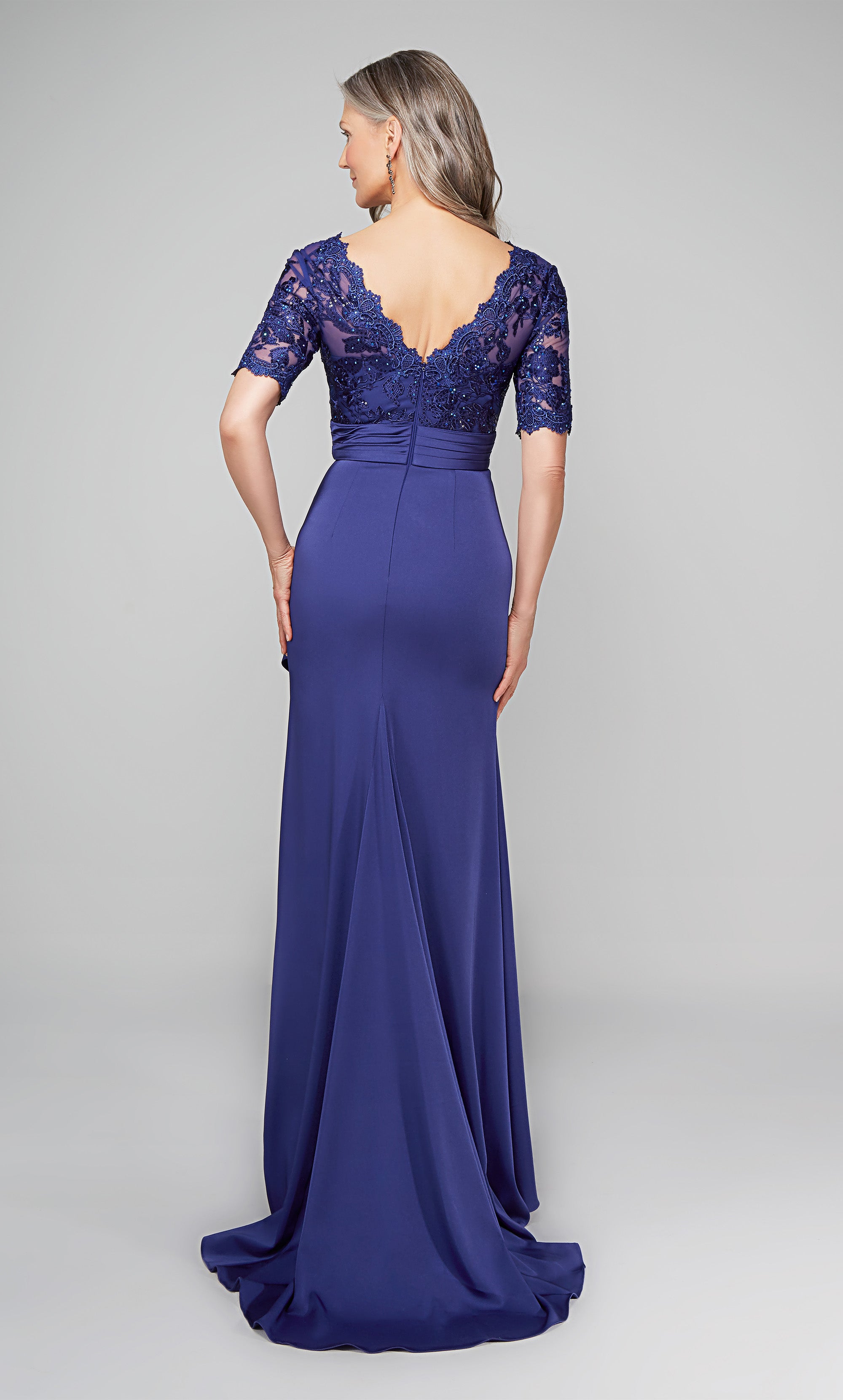 Long navy ruffle dress with a scalloped V neckline, faux belt at the natural waist, and short sleeves. Color-SWATCH_27595__NAVY