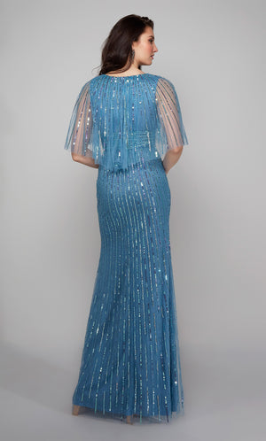 Embellished evening gown with a closed back and sheer capelet in blue.