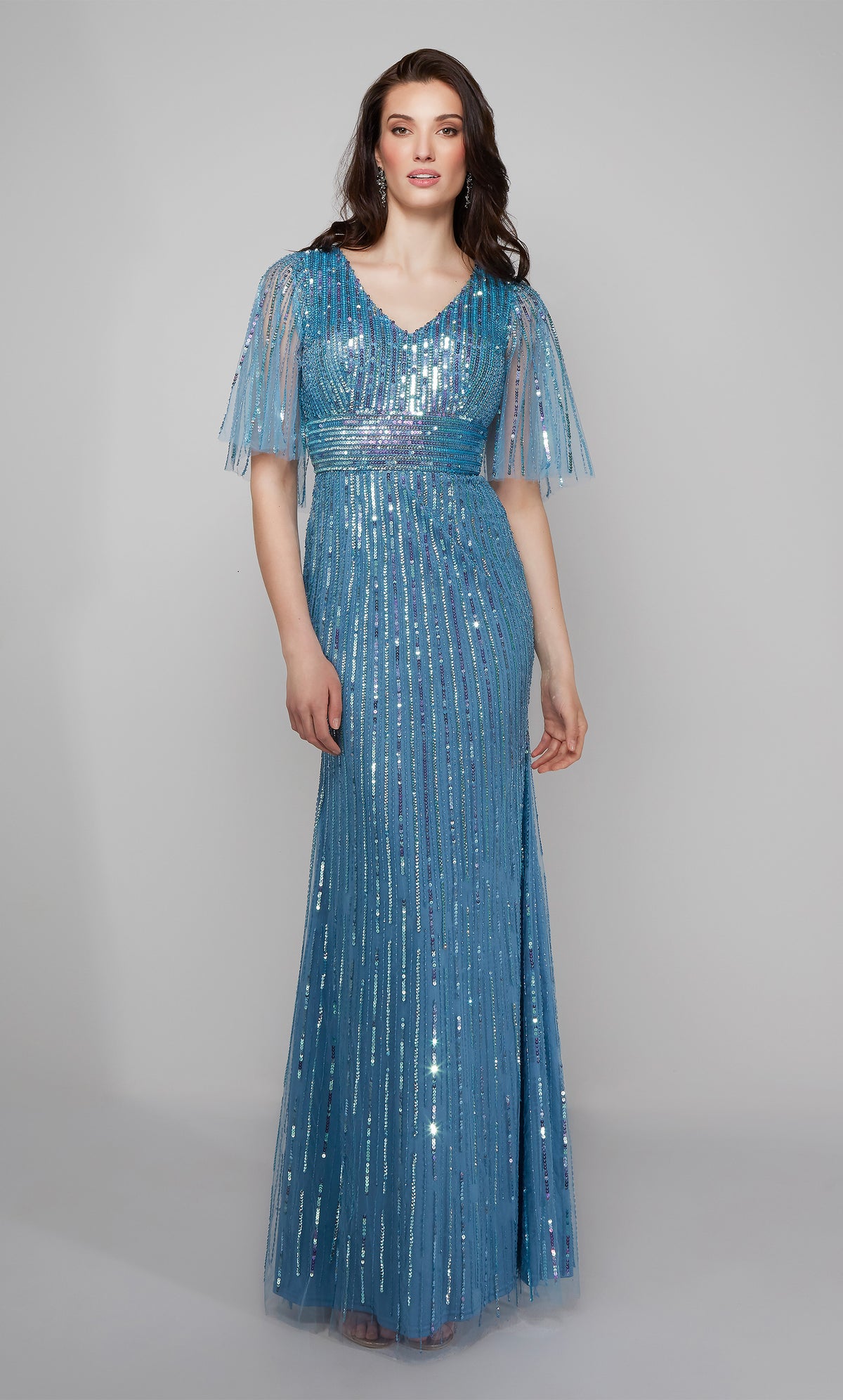 Sequin capelet gown with a V neck in blue.