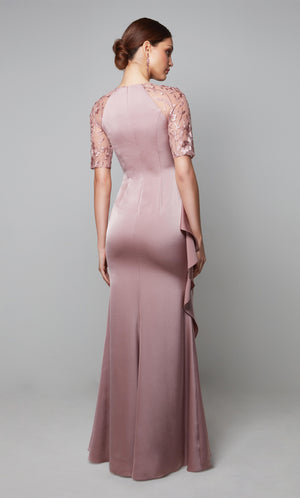 Ruched ruffle dress with a closed, zip up back and sheer lace sleeves in light pink.