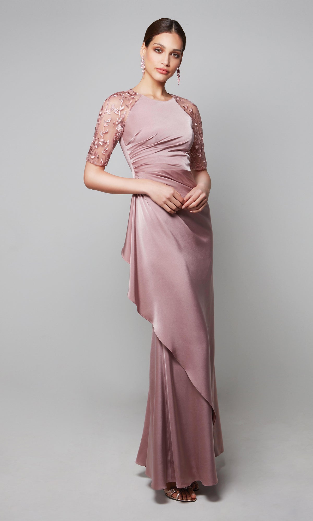 Long formal ruffle dress with a high neck and sheer lace sleeves in light pink.